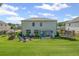 Expansive backyard featuring patio, trampoline, playground, fire pit, and lush green lawn at 3420 Pleasant Springs Dr, Cumming, GA 30028