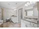 Bright bathroom featuring dual vanities, granite countertops, and a glass-enclosed shower at 3420 Pleasant Springs Dr, Cumming, GA 30028