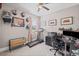 Bedroom with a home gym, artwork and light-colored carpet at 3420 Pleasant Springs Dr, Cumming, GA 30028