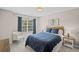 Comfortable bedroom with natural light, complemented by tasteful decor and plush bedding at 3420 Pleasant Springs Dr, Cumming, GA 30028