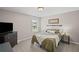 Neutral bedroom with a comfortable bed, dark dresser and side table and a view to the outdoors at 3420 Pleasant Springs Dr, Cumming, GA 30028