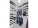 Spacious walk-in closet with custom shelving and ample storage for clothes and accessories at 3420 Pleasant Springs Dr, Cumming, GA 30028