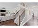Spacious entryway featuring hardwood floors, staircase and view of the living room and front door at 3420 Pleasant Springs Dr, Cumming, GA 30028