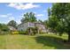Beautiful two story home with a well manicured lawn, stone accents and mature landscaping at 3420 Pleasant Springs Dr, Cumming, GA 30028