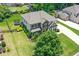 Aerial view of a home with stone accents and a well manicured lawn at 3420 Pleasant Springs Dr, Cumming, GA 30028