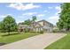 Two story traditional home with a long driveway and an attached two car garage at 3420 Pleasant Springs Dr, Cumming, GA 30028