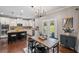 Open kitchen with stainless steel appliances, a kitchen island, and a dining area nearby at 3420 Pleasant Springs Dr, Cumming, GA 30028