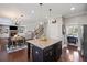 Modern kitchen with granite island, stainless steel appliances, and open layout at 3420 Pleasant Springs Dr, Cumming, GA 30028