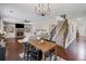 Spacious living room with hardwood floors, a fireplace, a ceiling fan, and a staircase at 3420 Pleasant Springs Dr, Cumming, GA 30028