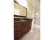 A view of a bathroom featuring a vanity with dark countertop, toilet, and tiled floor at 3541 Roswell Ne Rd # 20, Atlanta, GA 30305