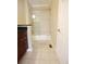 Bathroom featuring a shower/tub combo with sliding glass doors, vanity, and tiled floor at 3541 Roswell Ne Rd # 20, Atlanta, GA 30305