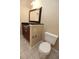 Well-lit bathroom featuring a vanity with dark countertop, toilet, and tiled floor at 3541 Roswell Ne Rd # 20, Atlanta, GA 30305