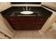 Close-up of a bathroom vanity with a dark countertop and sink, complemented by stylish cabinetry at 3541 Roswell Ne Rd # 20, Atlanta, GA 30305