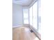 Angle view of large windows letting in light, wood floor, and a view of the outside at 3541 Roswell Ne Rd # 20, Atlanta, GA 30305
