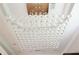 Close-up of an elegant crystal chandelier hanging from the ceiling at 3541 Roswell Ne Rd # 20, Atlanta, GA 30305