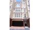 Charming townhouse with brick accents, large windows, and an attached garage at 3541 Roswell Ne Rd # 20, Atlanta, GA 30305