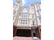 Stately multi-story townhome featuring brick accents and an attached two-car garage at 3541 Roswell Ne Rd # 20, Atlanta, GA 30305
