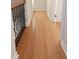 Hallway featuring hardwood floors, decorative railing, and a doorway at the end at 3541 Roswell Ne Rd # 20, Atlanta, GA 30305