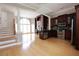 Open-concept kitchen and living area featuring dark wood cabinets and hardwood floors at 3541 Roswell Ne Rd # 20, Atlanta, GA 30305