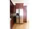 Stainless steel refrigerator with dark wood cabinets, hardwood floors and backsplash at 3541 Roswell Ne Rd # 20, Atlanta, GA 30305