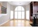 Bright living room with tall arch window and hardwood floors at 3541 Roswell Ne Rd # 20, Atlanta, GA 30305