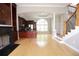 Living room with modern finishes, dark cabinets, fireplace, staircase, large window and an open floor plan at 3541 Roswell Ne Rd # 20, Atlanta, GA 30305