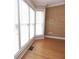 Bright room features a bay window, hardwood floors, and textured wallpaper at 3541 Roswell Ne Rd # 20, Atlanta, GA 30305