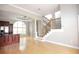 Bright living room featuring a staircase, an open floor plan, and a modern kitchen and appliances at 3541 Roswell Ne Rd # 20, Atlanta, GA 30305