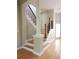 Staircase featuring decorative iron railing, wood steps, and column post at 3541 Roswell Ne Rd # 20, Atlanta, GA 30305