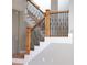 Staircase featuring wood steps and decorative metal spindles at 3541 Roswell Ne Rd # 20, Atlanta, GA 30305