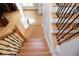View of the wood staircase featuring decorative black iron railing and newel post at 3541 Roswell Ne Rd # 20, Atlanta, GA 30305