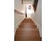 Staircase features hardwood treads, white risers and a wood handrail at 3541 Roswell Ne Rd # 20, Atlanta, GA 30305