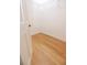 Walk-in closet featuring wood floor, white trim, an open door and wire shelving at 3541 Roswell Ne Rd # 20, Atlanta, GA 30305
