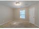 Empty bedroom with a window and door at 1464 Claredon Dr, Lawrenceville, GA 30043