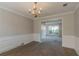 Open dining area with white wainscoting and trim, and view into a sunlit living space at 1464 Claredon Dr, Lawrenceville, GA 30043