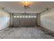 Attached garage with a concrete floor, gray paneled door, and an automatic opener at 1464 Claredon Dr, Lawrenceville, GA 30043