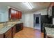 This kitchen features granite countertops, stainless steel appliances, and wood-look flooring at 1464 Claredon Dr, Lawrenceville, GA 30043