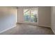 Sunlit room with large window and view to the greenery outside at 1464 Claredon Dr, Lawrenceville, GA 30043