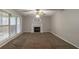 Living room with a fireplace, and large windows providing bright, natural light at 1464 Claredon Dr, Lawrenceville, GA 30043