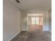 Spacious living room featuring neutral colored walls, and an archway to another room at 1464 Claredon Dr, Lawrenceville, GA 30043