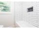 Modern bathroom with subway tile backsplash and an inset shelf at 2935 Catalina Dr, Decatur, GA 30032