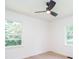 Sunlit bedroom with modern ceiling fan, two windows at 2935 Catalina Dr, Decatur, GA 30032