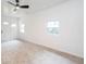 Bright bedroom featuring neutral carpet, white walls, and a modern ceiling fan at 2935 Catalina Dr, Decatur, GA 30032