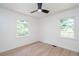 Bright bedroom with modern ceiling fan and two windows at 2935 Catalina Dr, Decatur, GA 30032