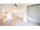 Bright bedroom features neutral carpet and a bathroom with white subway tile at 2935 Catalina Dr, Decatur, GA 30032