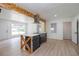 Bright kitchen has a unique island with breakfast bar, white cabinets, and modern stainless steel appliances at 2935 Catalina Dr, Decatur, GA 30032