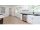 This lovely kitchen has stainless steel appliances, white cabinets, and modern fixtures at 2935 Catalina Dr, Decatur, GA 30032