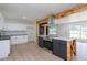 Bright kitchen boasts white cabinets, an island with breakfast bar, and modern stainless steel appliances at 2935 Catalina Dr, Decatur, GA 30032