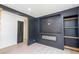 Cozy living room featuring a fireplace and built-in bookshelves at 2935 Catalina Dr, Decatur, GA 30032