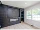 Modern living room featuring an electric fireplace and custom shelves at 2935 Catalina Dr, Decatur, GA 30032